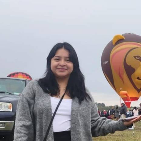 Andi Smiles at a hot air balloon festival