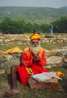 Hindu Saddhu sketching at the old temple grounds of a Buddhist site in Rajasthan. Photo by Hunter Marston, '07
