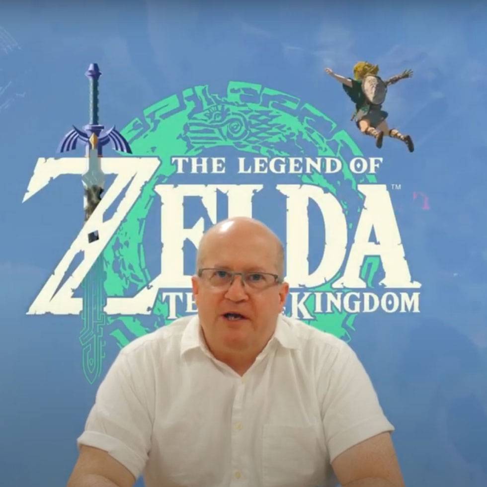 Image of Professor Dan Curley with Zelda screen in the background