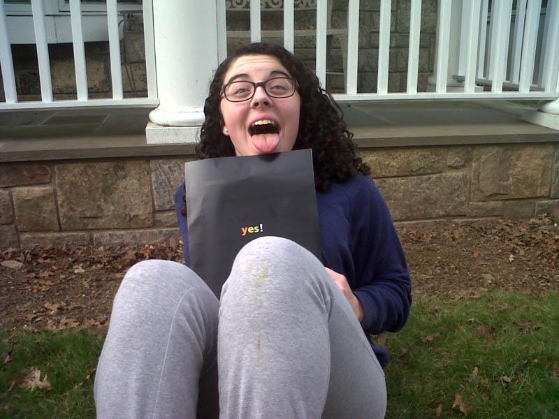 Julia%20Rutkovsky%20%2716%20poses%20with%20her%20Skidmore%20College%20acceptance%20packet.%20