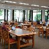 Students at work tables have more natural light. 