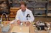 Skids helps the conservator mix up a solution