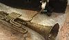When the curator turned her back for a moment, Skids tried to play the alto trombacello he found in the research center at the National Music Museum. He said it sounded kind of loud.
