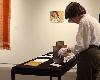 Professor Janet Sorensen viewing books by Whitney Packer.