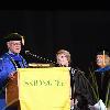 President Glotzbach presents Sallie 'Penny' Chisholm '69 with a honorary degree