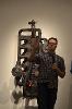 Artist Bryan Czibesz in front of Steve Montgomery's 'Static Fuel 4'