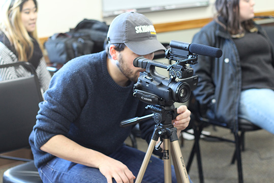 Student working with video camera