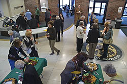Participants in the Mature Learners Lecture Series arrive in the Palamountain/Dana lobby for pre-lecture refreshments. (Photo by Erick Jenks)