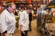 chefs study ingredients for competition