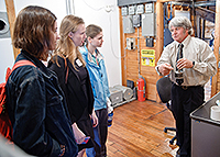 The Chittendon Falls hydro dam operator talks with Skidore students including Caroline Hobbs '16, center.