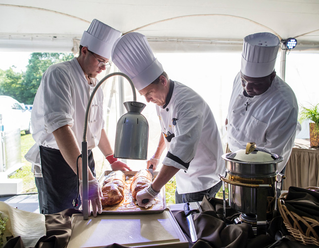 Skidmore College chefs work at a carving station