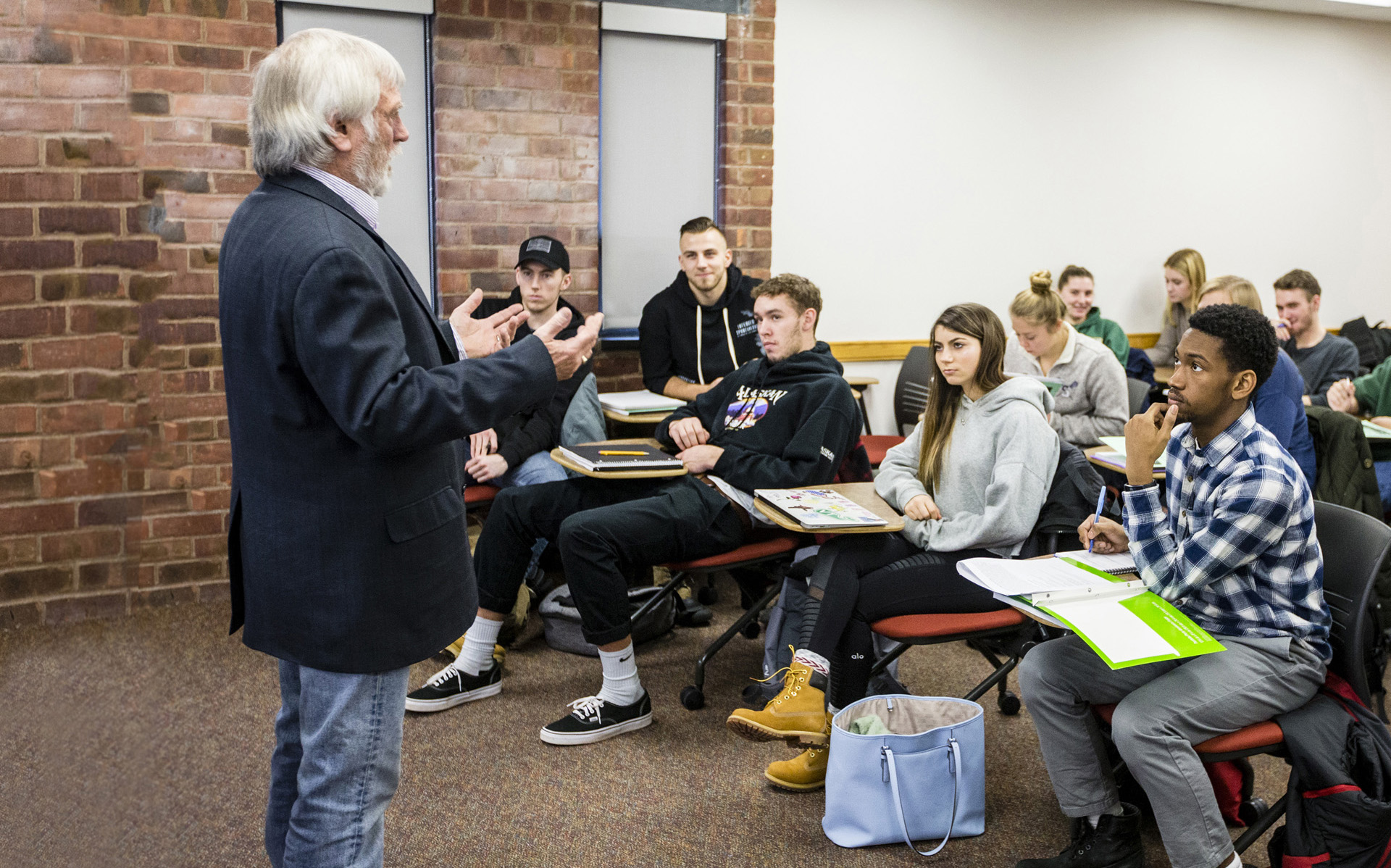 Jeff Segrave, Skidmore professor, talks to students about the Super Bowl