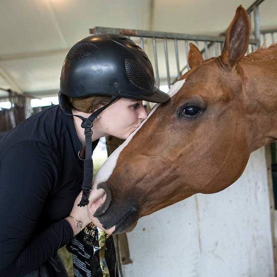 Horse+rider+kissing+her+horse