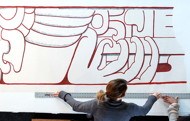 Heather Hurst measures out a closeup illustration from her Maya Temple art installation