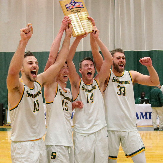 Skidmore+men%27s+basketball+players+celebrate+after+wining+the+2019+Liberty+League+championship+