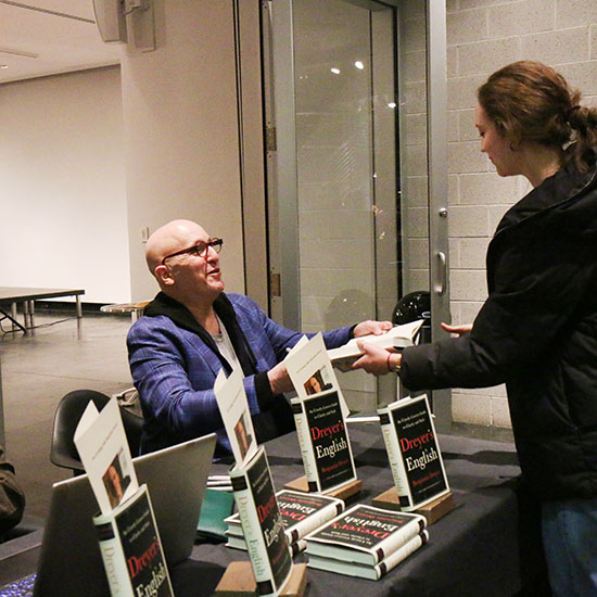 Dreyer+signs+copies+of+his+book+for+students