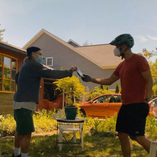 FYE+Director+Amon+Emeka+delivers+summer+reading+to+Professor+Sheldon+Solomon.+