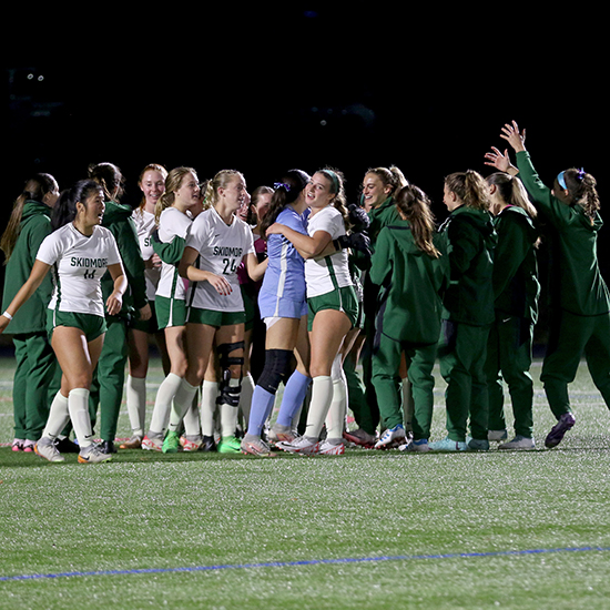 Women%27s+soccer+players+celebrating.+