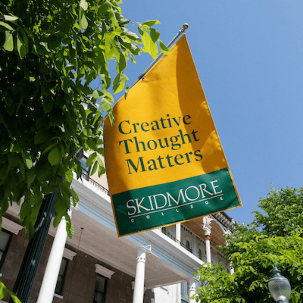 Skidmore's Creative Thought Matters banner hanging in downtown Saratoga Springs