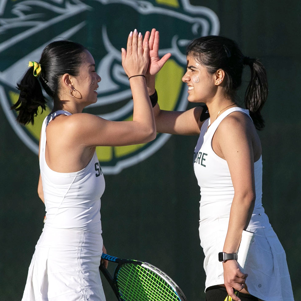 Konika and Grace on Skidmore's tennis courts