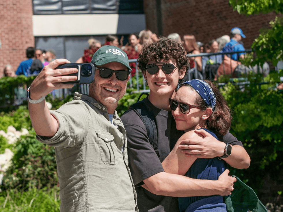 Student embraces parents during move-in and SCOOP.
