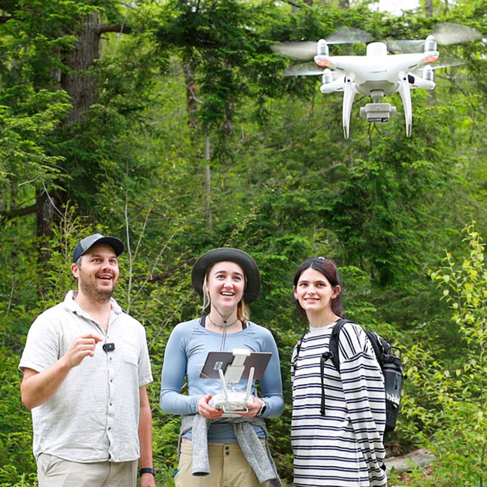 Avery Blake and Morgan Foster spent a summer researching spongy moths, formally known as Lymantria dispar moths, by conducting fieldwork with Charlie Bettigole, director of the GIS Center for Interdisciplinary Research, in the Lake George Watershed. Using GIS analytics, they tracked defoliation patterns and species behavior.