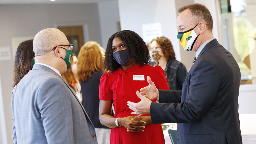 President Marc Conner, Vice President for Strategic Planning and Institutional Diversity Joshua Woodfork and Deputy Chief Diversity Officer and Director of The Center Anita Jack-Davies speak at an open house at The Center on Friday, Sept. 24.