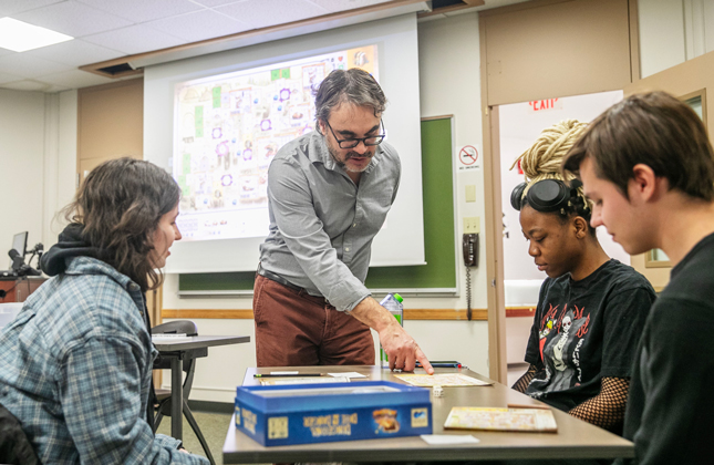 Professor of Psychology and Neuroscience Hassan Lopez introduces a roll-and-write game