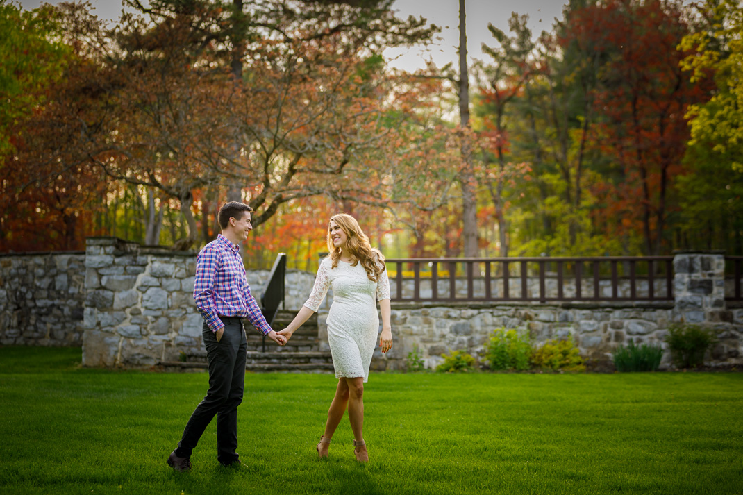 Couple walking hand in hand along the south porch