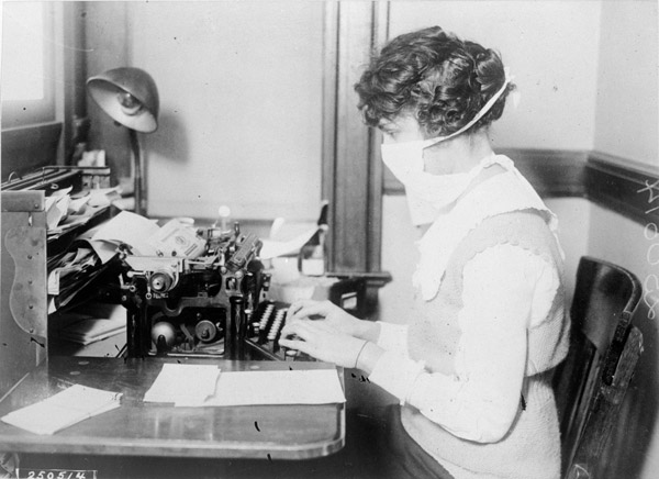 Masked typist protects herself from spanish flu 1918