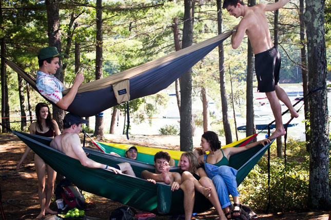 Skidmore students hang out in hammocks after a hike in the mountains