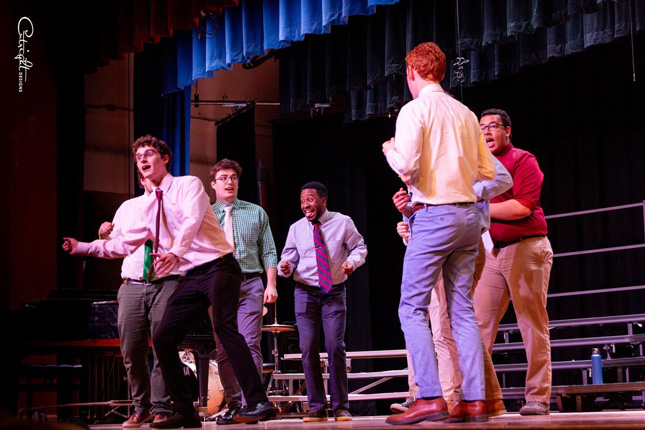 Men's acapella group performing on stage