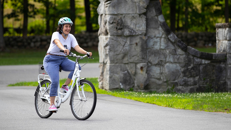 Hadia Bakkar with a bike at Skidmore College