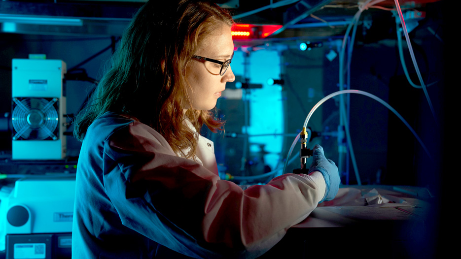 Heather Ricker, a Skidmore college student, conducts an experiment in a chemistry lab