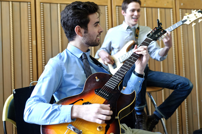 Skidmore student plays a guitar at The Spa at Skidmore College