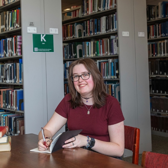 Mia+McCormack+%E2%80%9927%2C+a+peer+tutor+in+ancient+Greek%2C+studies+in+Lucy+Scribner+Library%2C+where+she+often+helps+classmates+navigate+the+complexities+of+the+classics.