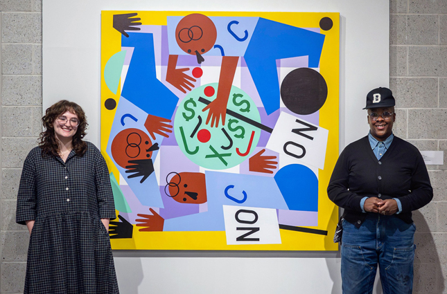 Allie Serapilio ’25 poses with artist Nina Chanel Abney and one of her works