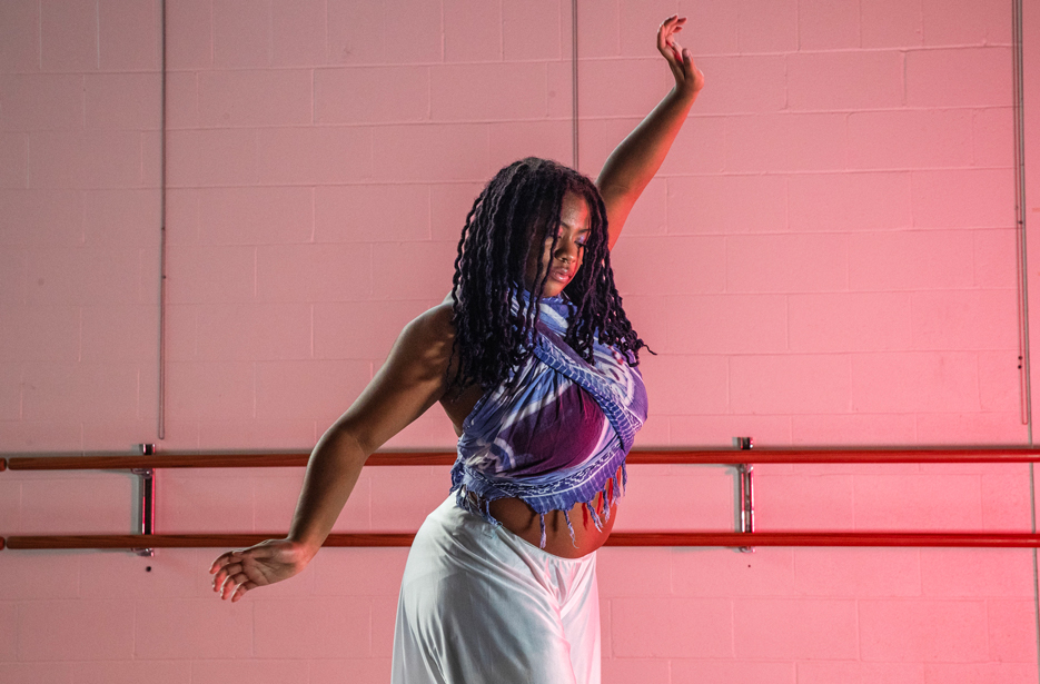 Aminah Hopewell ’26 mid-pose as she dances in a Skidmore dance studio