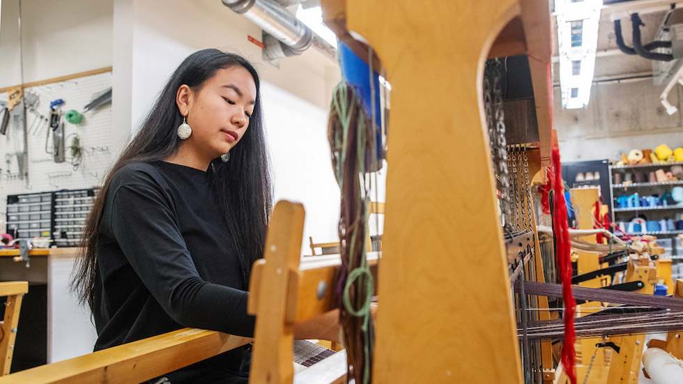 Lisa Shan working at a loom