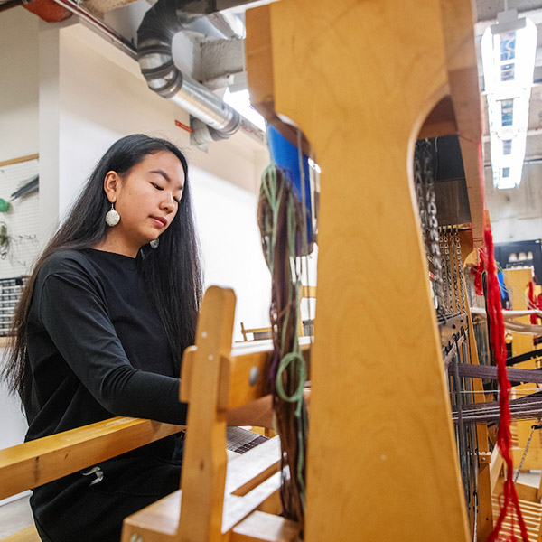 Lisa+Shan+working+at+a+loom