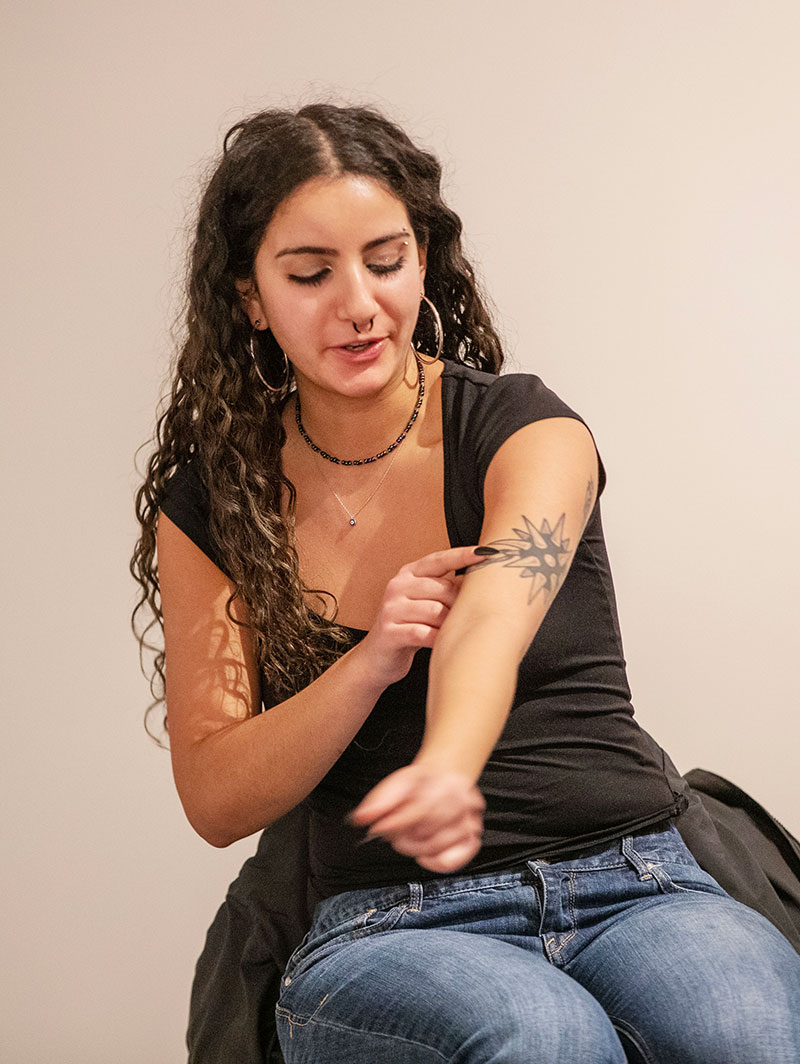 Georgia Varon ’26 points to a tattoo