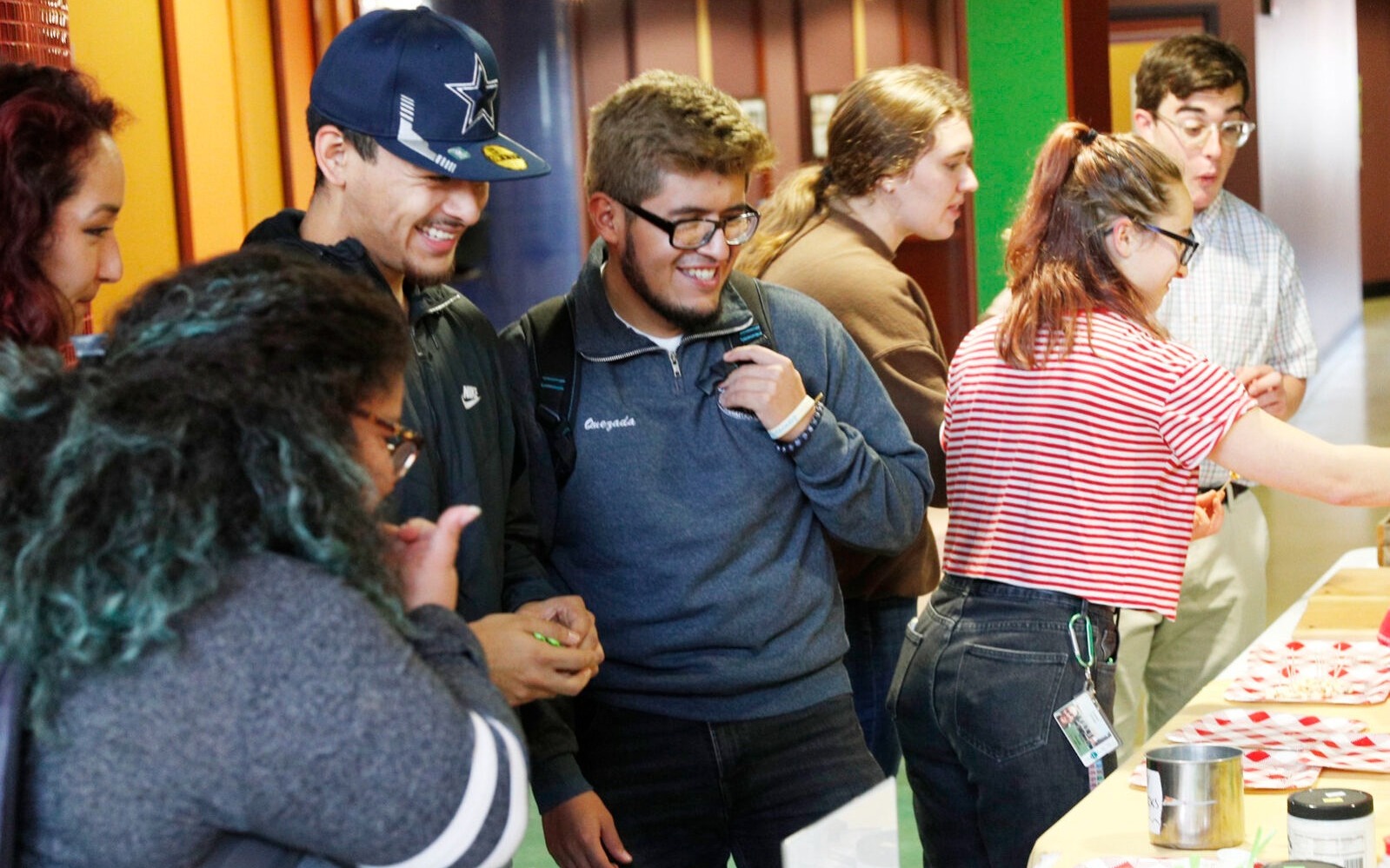 Students enjoy samples from local vendors at a farmers market-themed dinner.