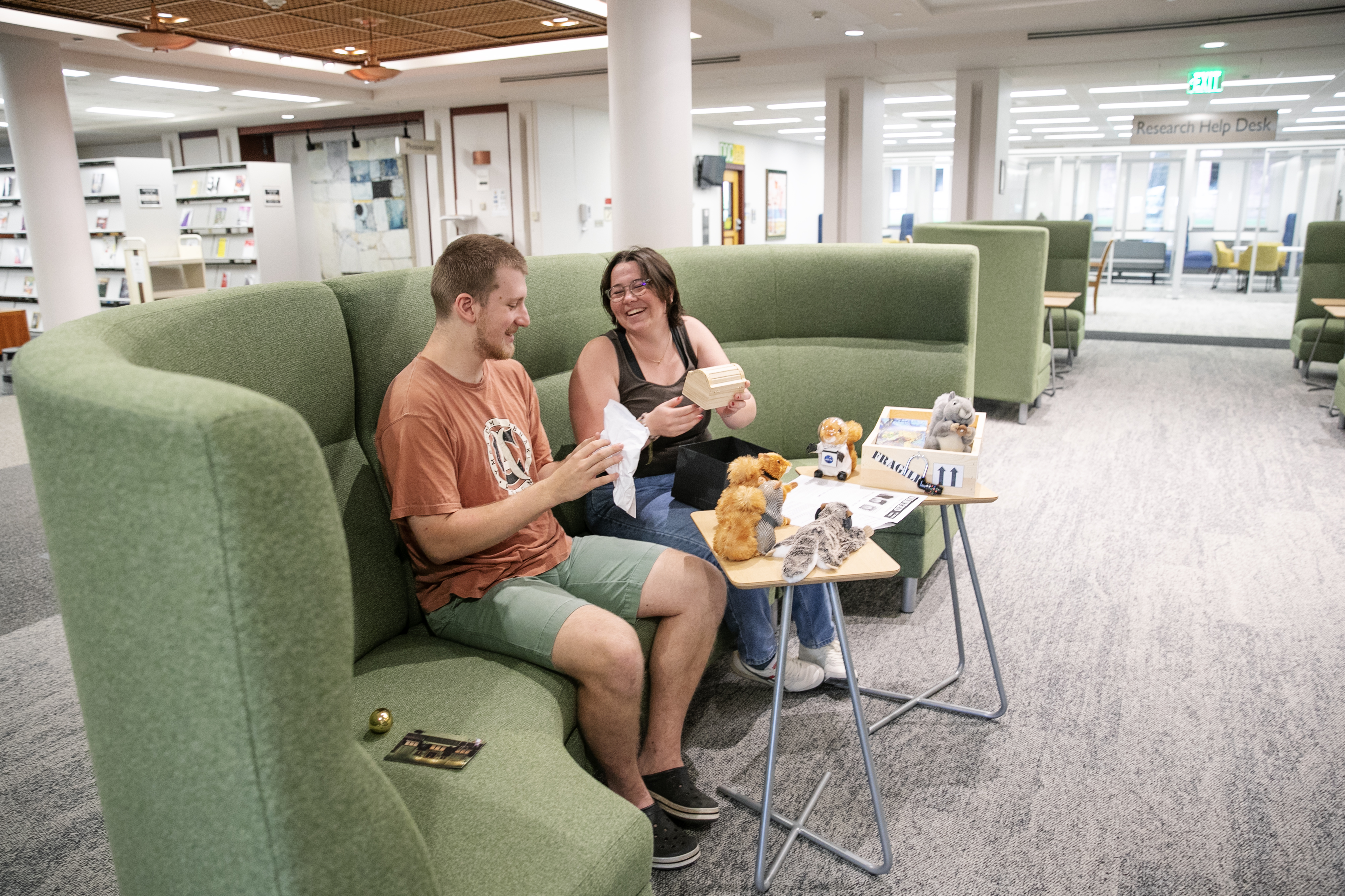 Liza Schnauck '25 and Ezra Shamy '25 work to solve Scribbler's code in Lucy Scribner Library's new Creative Corridor.