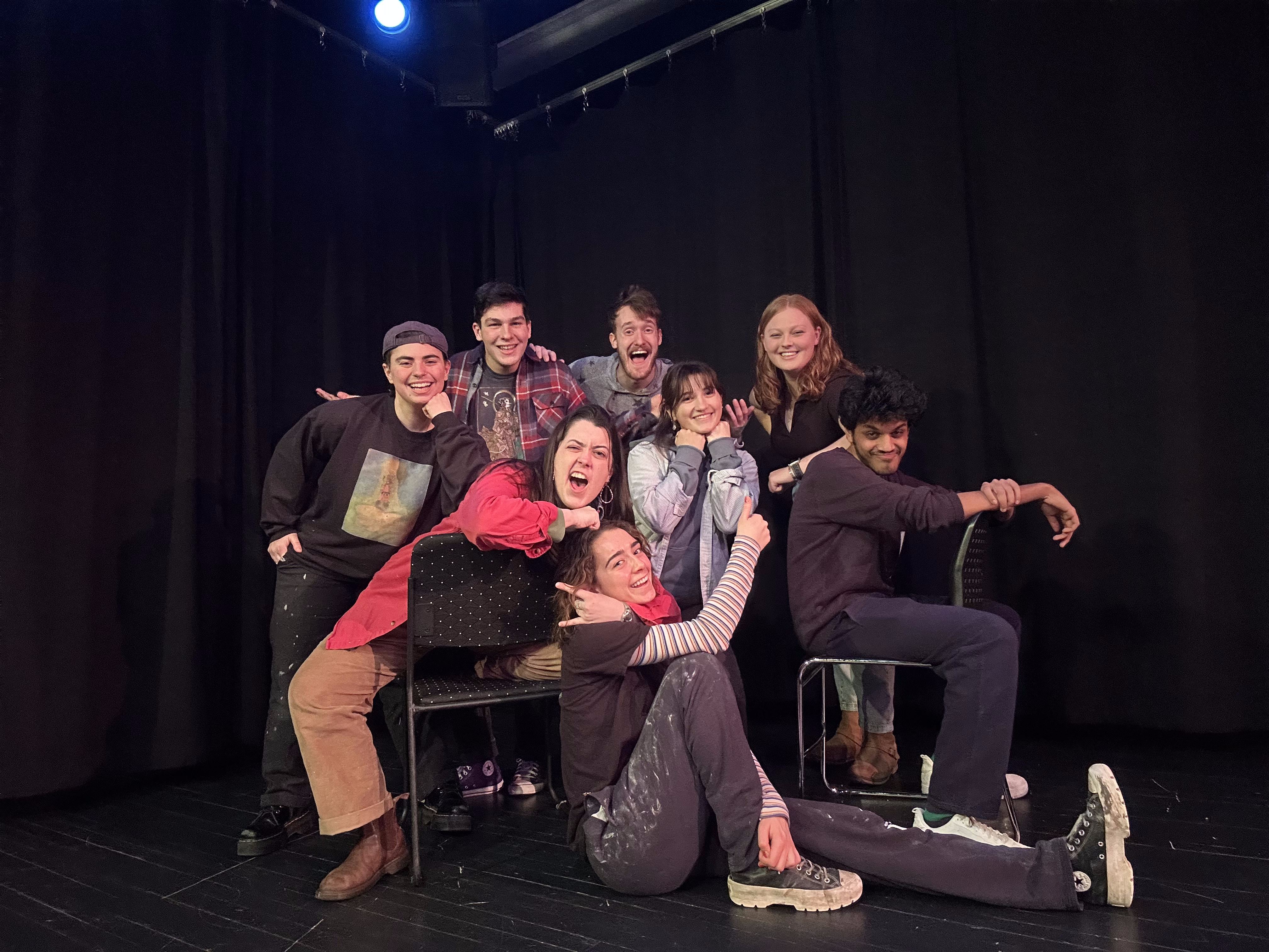 Elise Milner ’25, seated on the floor, is a member of Skidomedy, one of several Skidmore student clubs dedicated to comedy.