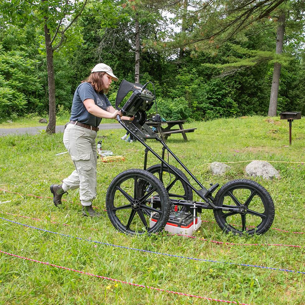 Student Lily Whelden ’25 works to excavate artifacts from the site of a Revolutionary War-era smallpox hospital in Lake George Battlefield Park with Associate Professor and Chair of Anthropology Siobhan Hart