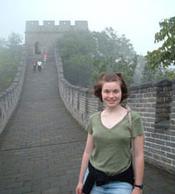 Anastasia Thomas, '08 standing on the Great Wall of China.