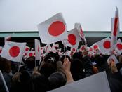 A crowd waving paper Japanese flags overhead to greet the Emperor as he welcomes the new year.Photo taken by Skidmore student Devin Sugameli