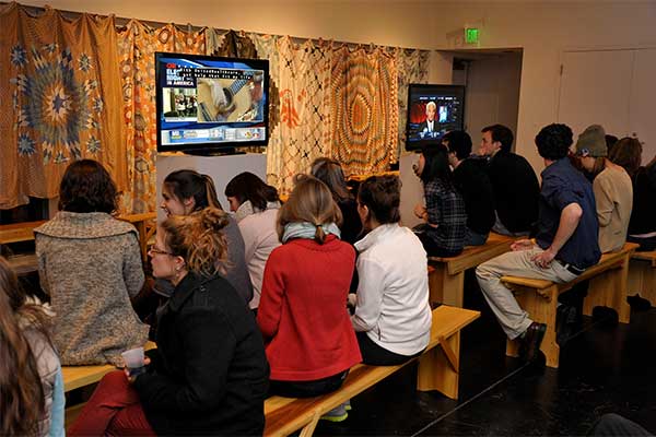 students watching tvs of results of presidential race
