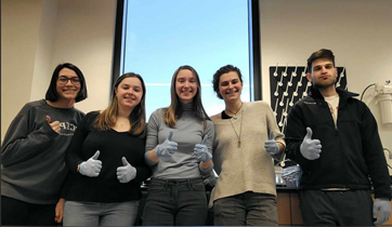Students giving thumbs up