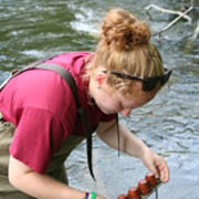 Claire Superak '11 sampling water